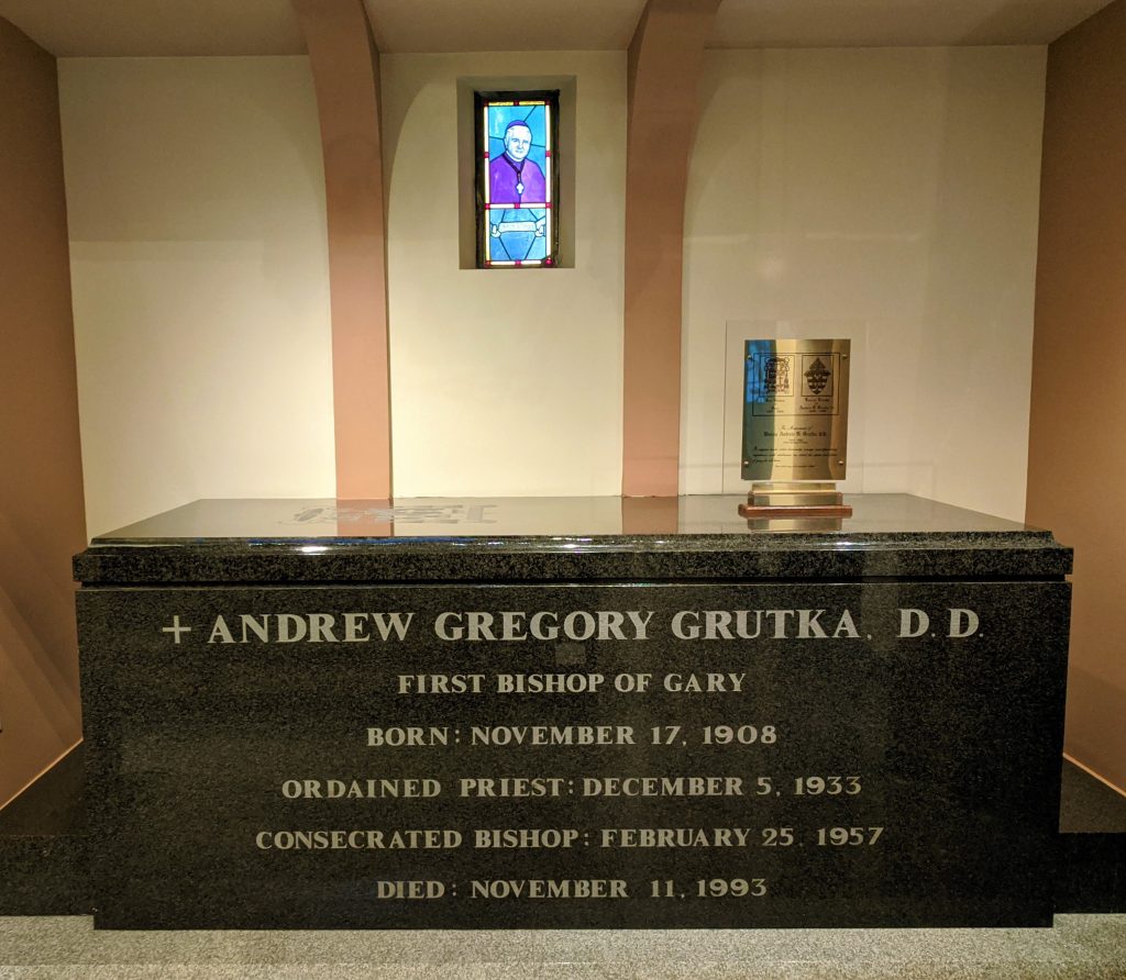 The tomb of Bishop Grutka. The tomb is made out of a black glossy stone.